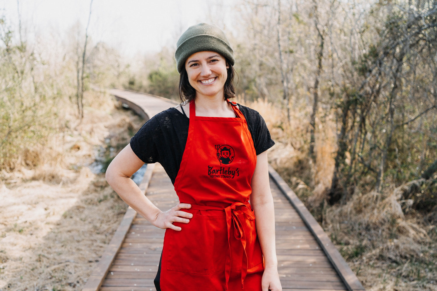 Women wearing red apron and beanie - stephanie kirkpatrick of bartleby's food in northwest arkansas 